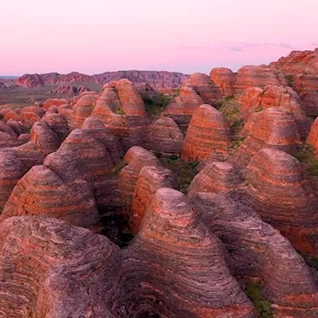 Australiaのインスタグラム：「Just your casual sunrise flight over the Bungle Bungle Range 💁 Thanks to @tarynyeatesphotography for giving us a bird's-eye view of this incredible sight in @australiasnorthwest. The otherworldly landscape of the #BungleBungles in #PurnululuNationalPark is best accessed from the @westernaustralia town of #Kununurra. You can explore the range on foot, take a guided tour, scenic flight, or experience it as part of a 4WD tour through #TheKimberley. You can even pitch a tent in the park at campsites like Bellburn, Walardi and Kurrajong ⛺ Find our more via the link in our bio! #seeaustralia #wanderoutyonder, #thisiswa #MagicKimberley #HolidayHereThisYear」
