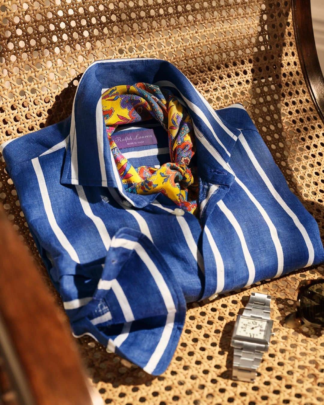 Ralph Laurenのインスタグラム：「#RLPurpleLabel welcomes coastal-inspired dressing in the Pre-Spring 2021 Capri collection. Light fabrics complement the relaxed silhouettes — as seen here with the Striped Linen Shirt, Floral Silk Scarf, and a timepiece from The 867 Collection.   Explore the entire collection via the link in bio.  #RalphLauren」
