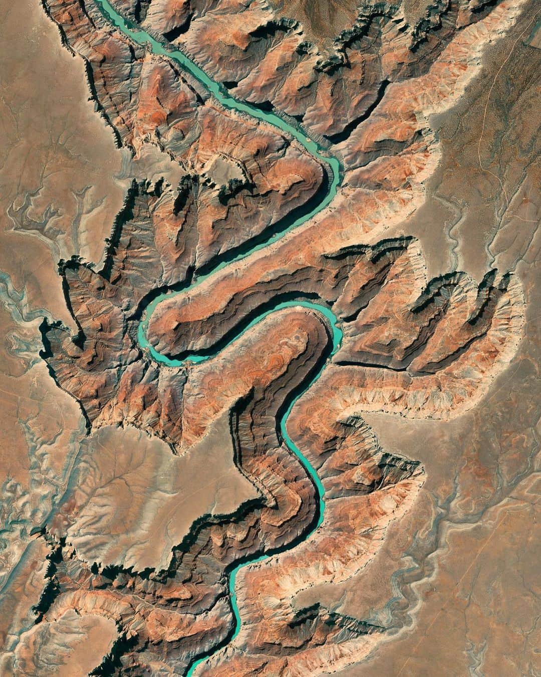 Daily Overviewのインスタグラム：「The Colorado River and the trajectory of its current flow were formed roughly 5 million years ago. Due to tectonic activity, the Colorado Plateau continued to rise from 5 million to 2.5 million years ago, thereby shifting the direction of the river. With its new path, the river began to erode the area in present-day Arizona now known as the Grand Canyon. The canyon is situated just a few miles south of the river section captured in this Overview. - You can find this image in the introduction of our latest book, “Overview Timelapse.” Link in bio to learn more. — Created by @overview Source imagery: @maxartechnologies」